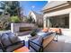 Outdoor patio with fireplace, comfortable seating, and lush landscaping for stylish relaxation and entertaining at 40 Royal Ann Dr, Greenwood Village, CO 80111