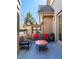 Cozy outdoor patio featuring comfortable seating, a table, and tasteful decor with brick surround at 40 Royal Ann Dr, Greenwood Village, CO 80111