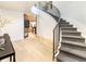 Elegant foyer with a curved staircase, hardwood floors, and an open view to other living spaces at 40 Royal Ann Dr, Greenwood Village, CO 80111