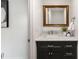 Stylish half bathroom with updated vanity and decorative mirror at 12648 W Virginia Ave, Lakewood, CO 80228