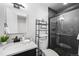 Modern bathroom with glass shower, updated vanity, and decor at 12648 W Virginia Ave, Lakewood, CO 80228