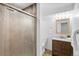 Cozy bathroom with glass-door shower and stylish vanity at 12648 W Virginia Ave, Lakewood, CO 80228