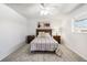 Cozy bedroom with neutral color palette, plush carpet, and natural light at 12648 W Virginia Ave, Lakewood, CO 80228