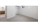 Carpeted bedroom with closet and ensuite bath at 12648 W Virginia Ave, Lakewood, CO 80228