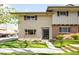 Charming two-story home featuring a well-maintained lawn and brick accents at 12648 W Virginia Ave, Lakewood, CO 80228