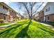 Beautifully maintained lawns and mature trees give this community a park-like setting at 12648 W Virginia Ave, Lakewood, CO 80228