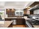 Well-equipped kitchen with granite counters, stainless appliances, and stylish backsplash at 12648 W Virginia Ave, Lakewood, CO 80228