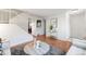 Spacious living room featuring wood floors, staircase, and stylish accents at 12648 W Virginia Ave, Lakewood, CO 80228