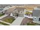 Aerial view of a two-story home showcasing the front yard, driveway, backyard and surrounding neighborhood at 1527 Biffle Ct, Berthoud, CO 80513