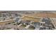 Aerial view of neighborhood showcasing a collection of two-story homes, streets, and open land at 1527 Biffle Ct, Berthoud, CO 80513