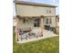 Spacious backyard patio area with fire pit, outdoor seating, pergola, and grill at 1527 Biffle Ct, Berthoud, CO 80513
