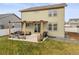 Backyard patio with a pergola, an outdoor seating area, and a well-manicured lawn with privacy fence at 1527 Biffle Ct, Berthoud, CO 80513