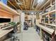 Finished basement office and storage areas with custom shelving and desk at 1527 Biffle Ct, Berthoud, CO 80513