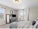 Comfortable bedroom with neutral walls, carpet, and large window at 1527 Biffle Ct, Berthoud, CO 80513