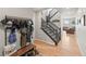 Inviting entryway with wood flooring, a coat rack, and a staircase leading to the upper level at 1527 Biffle Ct, Berthoud, CO 80513