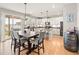 Bright, modern kitchen and dining area with stainless steel appliances, and stylish decor at 1527 Biffle Ct, Berthoud, CO 80513