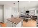 Open-concept floor plan showcasing a well-appointed kitchen with a view to a dining and living space at 1527 Biffle Ct, Berthoud, CO 80513
