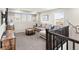 Cozy living room with plush carpeting, neutral paint, comfortable seating, and abundant natural light at 1527 Biffle Ct, Berthoud, CO 80513
