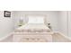 Bedroom with cream bedframe, patterned comforter, and decorative lamps at 945 Jackson St, Denver, CO 80206