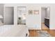 Bedroom showcases wood floors, mirrored closet doors, and ensuite bathroom at 945 Jackson St, Denver, CO 80206