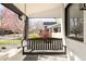 Relaxing front porch with swing and view of the neighborhood at 945 Jackson St, Denver, CO 80206