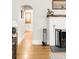 Living room with a fireplace featuring stylish decor and hardwood floors at 945 Jackson St, Denver, CO 80206