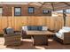 Backyard patio seating area with comfortable wicker furniture and fire table for outdoor enjoyment at 945 Jackson St, Denver, CO 80206