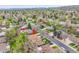 Aerial view of a neighborhood showcasing the home's location near mature trees and streets at 460 S Taft St, Lakewood, CO 80228