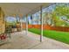 Outdoor patio featuring a built-in grill and a manicured lawn, great for entertaining at 460 S Taft St, Lakewood, CO 80228