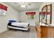 Bright bedroom with natural light, dresser, and cozy bed at 460 S Taft St, Lakewood, CO 80228