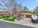 Charming single-story home with a well-maintained lawn, mature trees, and a two car garage at 460 S Taft St, Lakewood, CO 80228