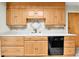 Updated kitchen with wooden cabinets and stainless appliances at 460 S Taft St, Lakewood, CO 80228