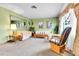 Cozy living room featuring comfortable seating, a large window, and classic decor at 460 S Taft St, Lakewood, CO 80228