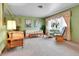Cozy living room featuring comfortable seating, a large window, and classic decor at 460 S Taft St, Lakewood, CO 80228