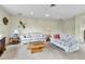 Bright living room featuring neutral tones, comfortable seating, and an open layout at 460 S Taft St, Lakewood, CO 80228