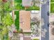 Bird's eye view of the house featuring a well-kept lawn, mature trees, and an RV parking area at 460 S Taft St, Lakewood, CO 80228
