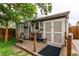 Backyard shed featuring a small porch area, offering a cozy outdoor space at 840 Essex Dr, Denver, CO 80229
