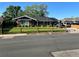 Charming single-story home with a well-maintained lawn and a covered front porch at 840 Essex Dr, Denver, CO 80229