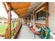 Welcoming front porch with decorative bench and exterior lighting at 840 Essex Dr, Denver, CO 80229