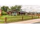 Charming home with a well-manicured lawn and inviting wood fence at 840 Essex Dr, Denver, CO 80229