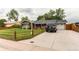 Charming home with long driveway leading to a two car garage at 840 Essex Dr, Denver, CO 80229