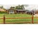 Home with lush front lawn and wood fence and ample parking space at 840 Essex Dr, Denver, CO 80229