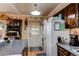 Well-lit kitchen area featuring counter space, appliances, and a door leading to the outside at 840 Essex Dr, Denver, CO 80229