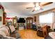 Inviting living room with hardwood floors, a comfortable sofa, and decorative displays at 840 Essex Dr, Denver, CO 80229