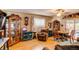 Cozy space features hardwood floors, a ceiling fan, and a view of the backyard at 840 Essex Dr, Denver, CO 80229