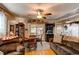Living room and dining area with hardwood floors and backyard access at 840 Essex Dr, Denver, CO 80229