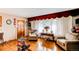 Inviting living room featuring hardwood floors and ample natural light at 840 Essex Dr, Denver, CO 80229