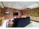Finished basement with built-in shelving and comfortable seating at 559 N Williams St, Denver, CO 80218