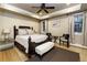 Well-lit bedroom with hardwood floors and ceiling fan at 559 N Williams St, Denver, CO 80218