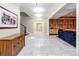 Bright hallway with tile floors and built-in shelving at 559 N Williams St, Denver, CO 80218